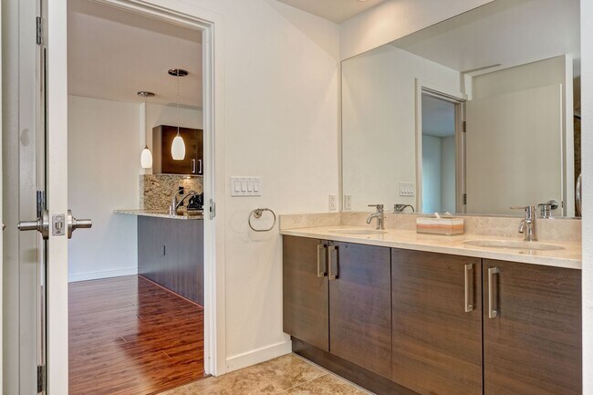Building Photo - Modern Downtown Condo in Premier High-Rise...