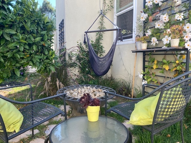 Sit (or swing) around the firepit. - 9730 Regent St