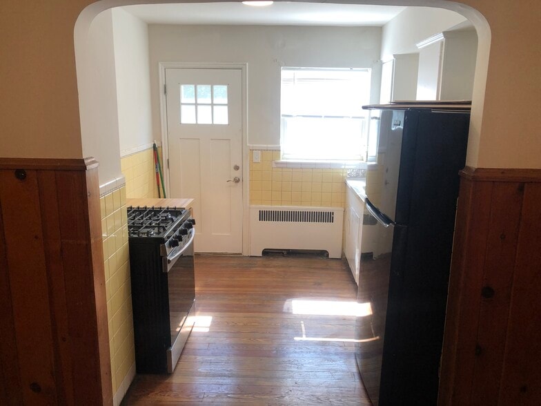Kitchen with private rear entrance - 1711 Portman Ave