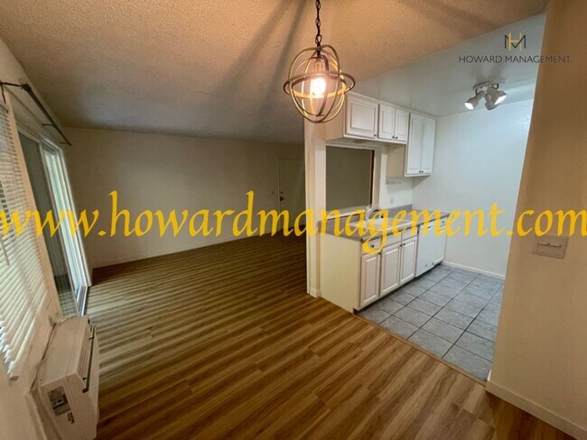 Building Photo - Bonus Den! Beautiful lower condo with large patio in Tara Hills, a resort style living complex!