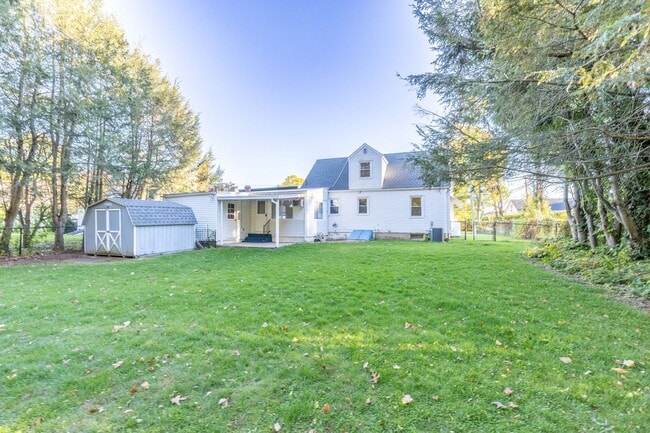 Primary Photo - Charming 3-Bedroom Home with Solar Panels ...