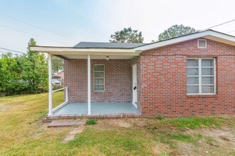 Building Photo - Brick home with a fenced-in yard!