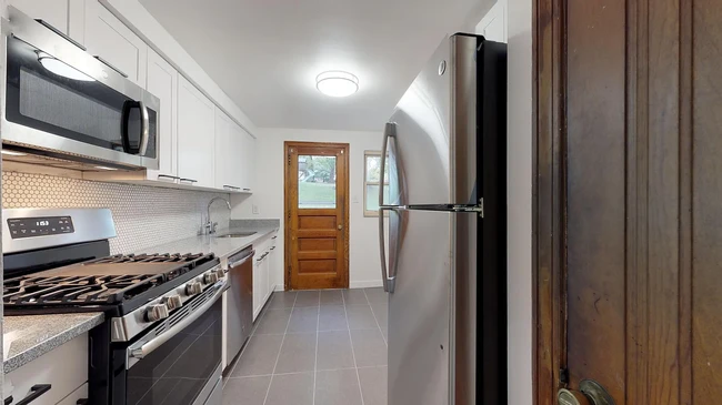 Kitchen has new LED ceiling lighting with access to large backyard and patio - 31 Marylea Ave