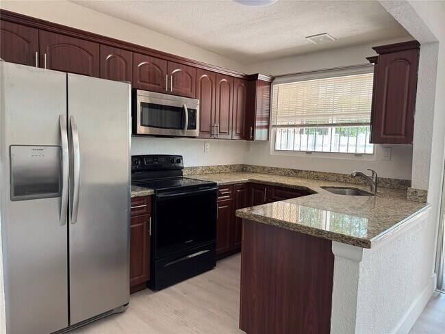 Building Photo - West 81st Place, Hialeah, FL 33014 - 4 BR 2.5 BA townhouse