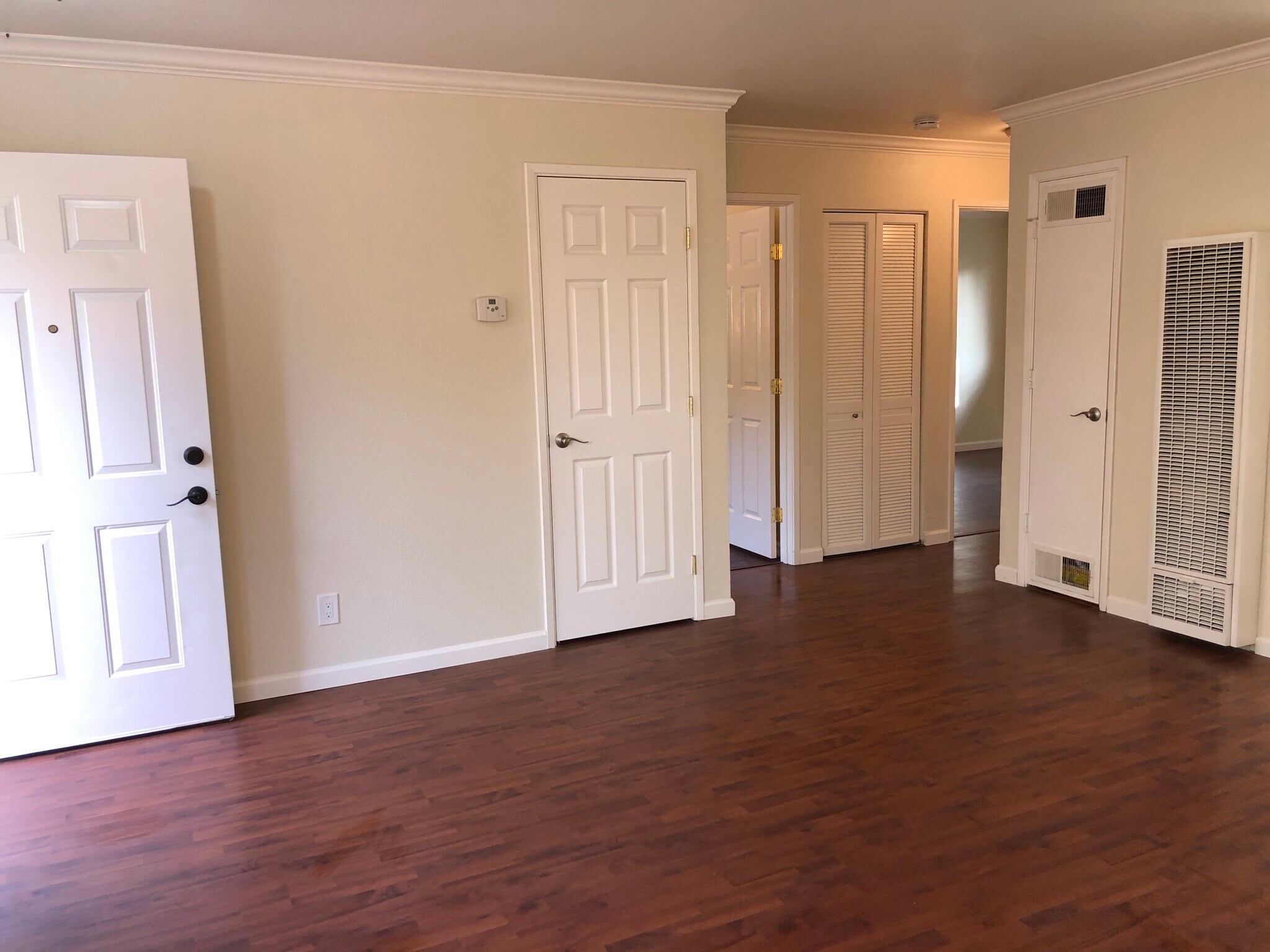 Living room closet & laundry closet with newer stacked large capacity washer & dryer. - 375 N M St