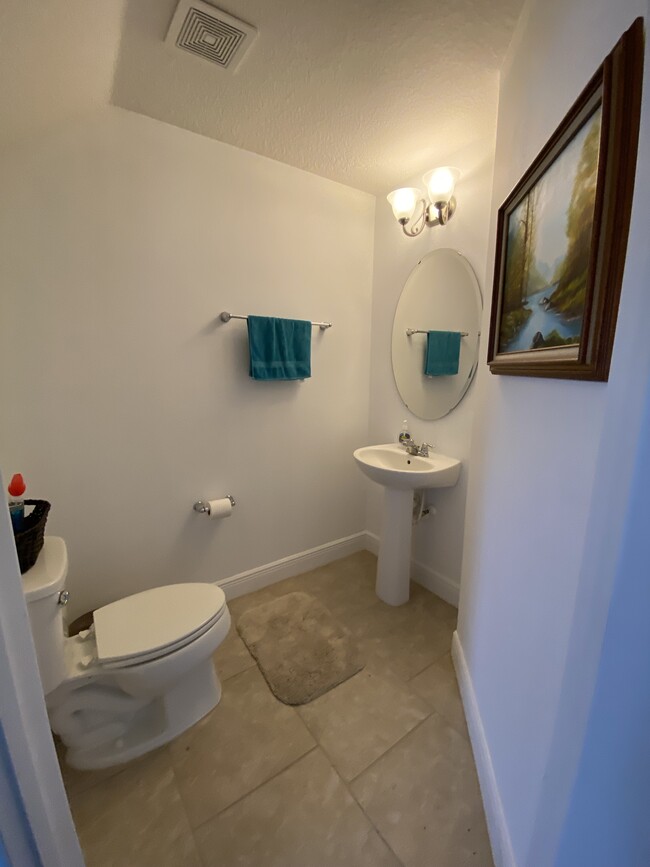 1st floor-half bathroom - 10814 Sunset Ridge Ln