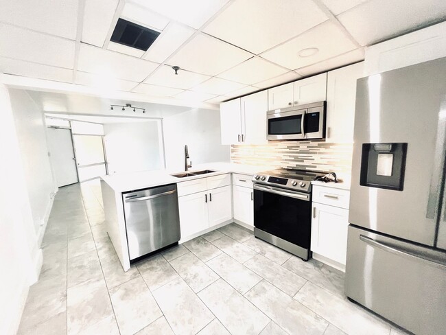 Building Photo - Live in Luxury and Convenience in the Hear...