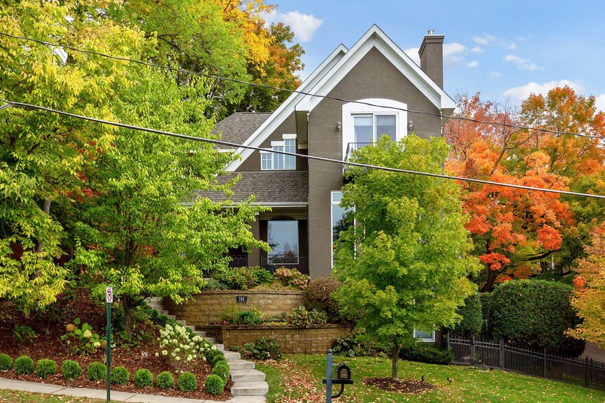 Admire the fabulous curb appeal and exquisite landscaping that greet you - 745 Rice St E