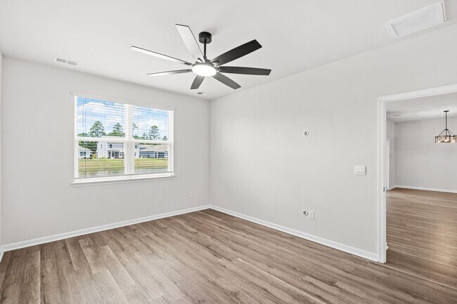 Building Photo - Modern 4BR Home with Screened Porch & Pond Views | Sun Colony, Longs SC