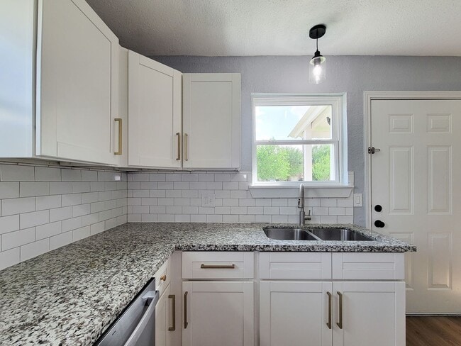 Building Photo - This beautifully updated 4-bedroom home is just under two miles from Highway 288 and Loop 610, ma...