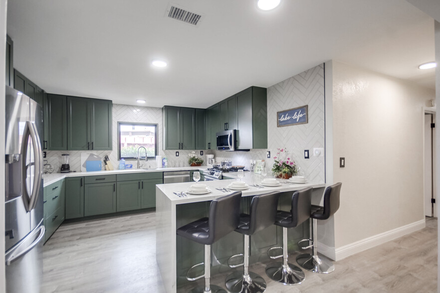 Where meals and memories are made! Our kitchen island is perfect for gatherings. - 5551 Churchward St