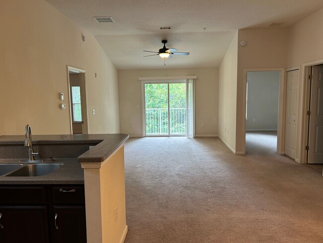 Building Photo - 2 Bed 2 Bath Condo in Gated Community with Balcony Views! Plenty of Amenities, Washer & Dryer and...