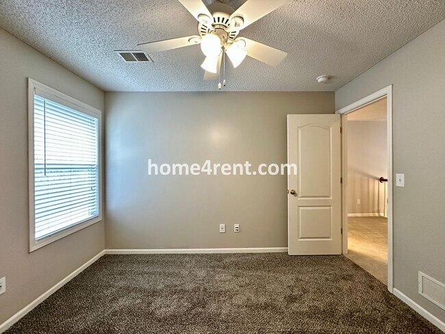 Building Photo - Beautiful Four-Bedroom Home with Three Car Garage, Wood Floors, Finished Basement and a Fenced Ya...