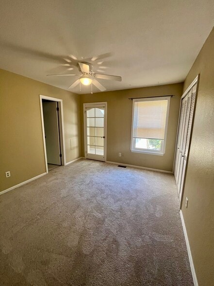 Second bedroom with view of door to bonus room - 3097 Fulton Circle