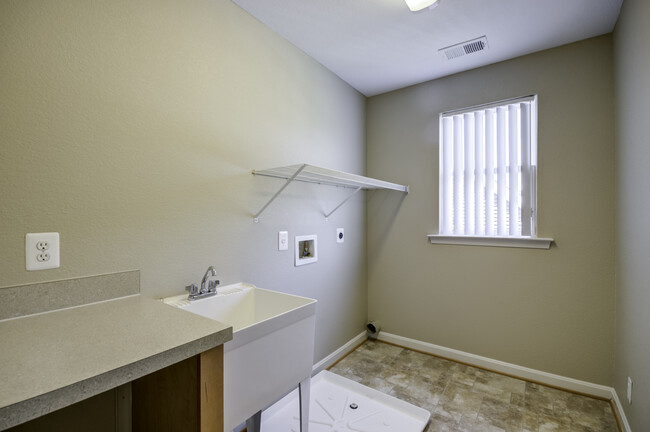 Laundry room (washer and dryer NOT included) - Riverview Village Townhomes
