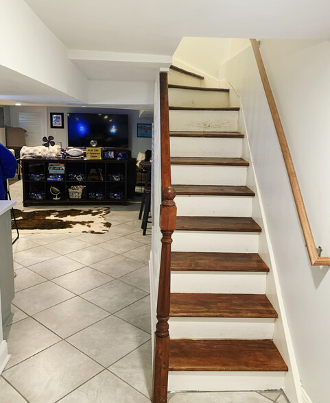 Stairs to heated/cooled fully finished basement. - 74 Peters Pl