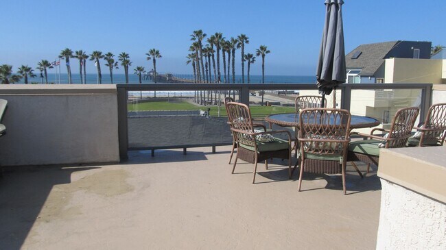 Building Photo - Steps to the Beach with rooftop deck