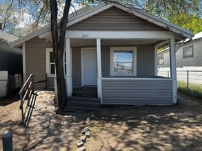 Building Photo - Quaint home with fully fenced yard and updates