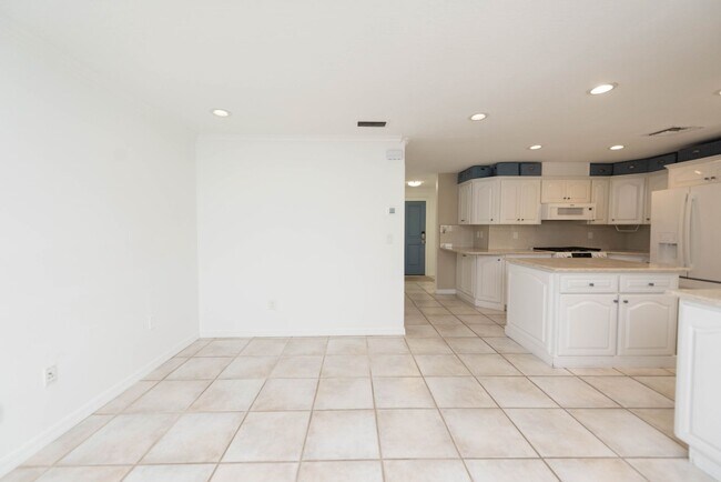 Building Photo - Live the ultimate Space Coast waterfront lifestyle at this stunning beachside canal home in Satel...