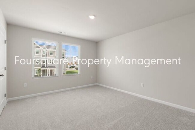 Building Photo - Coming Soon; July 27, 2026 : End unit ToSpacious End-Unit Townhome with 2nd Floor Loft, Screened-...