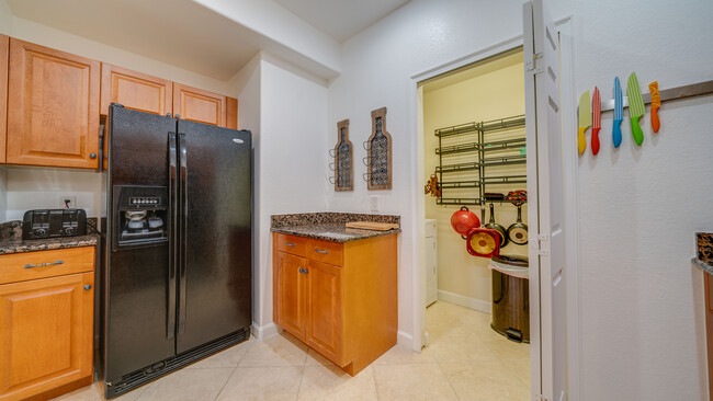 Kitchen with laundry closet - 13110 Bella Casa Cir