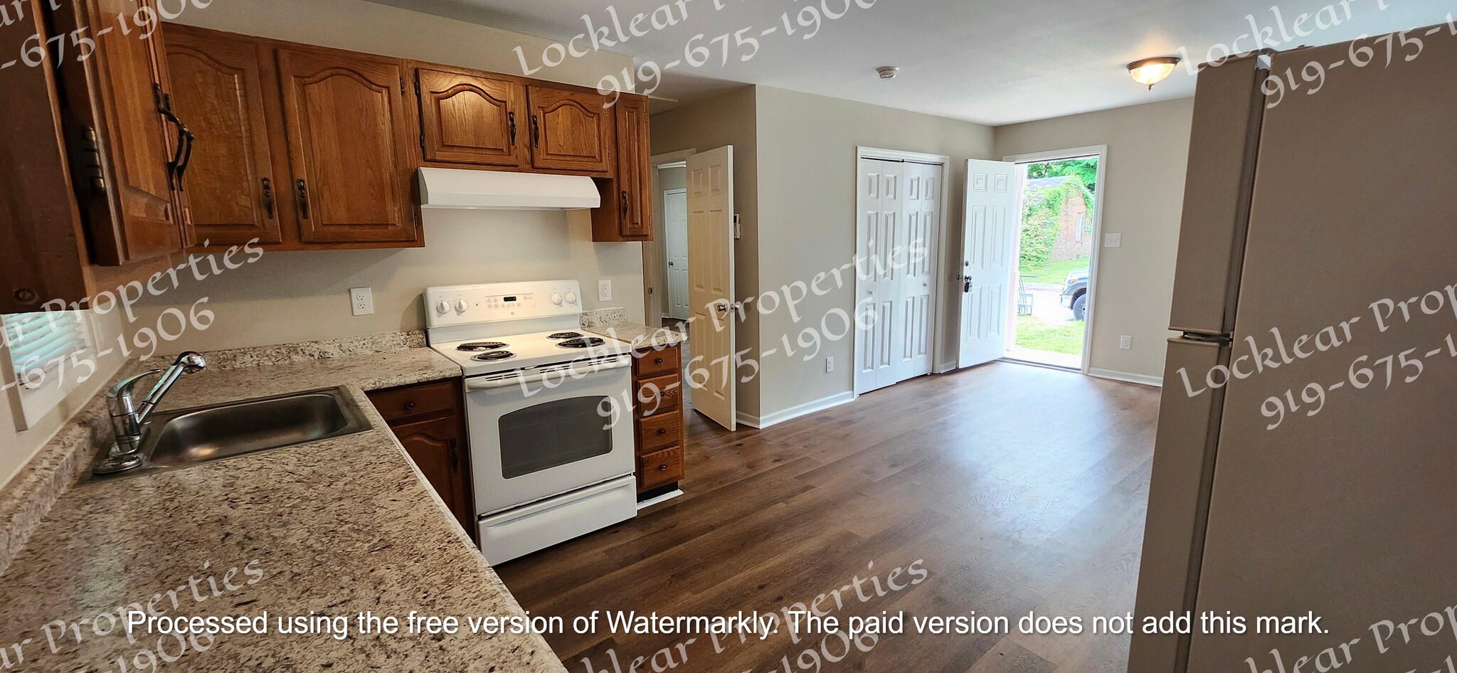 View of living room and laundry closet - 612 Hugh St