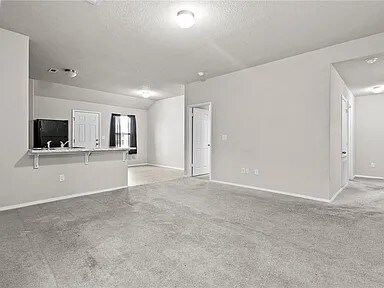 Living room facing kitchen - 5018 W Claxton Cir
