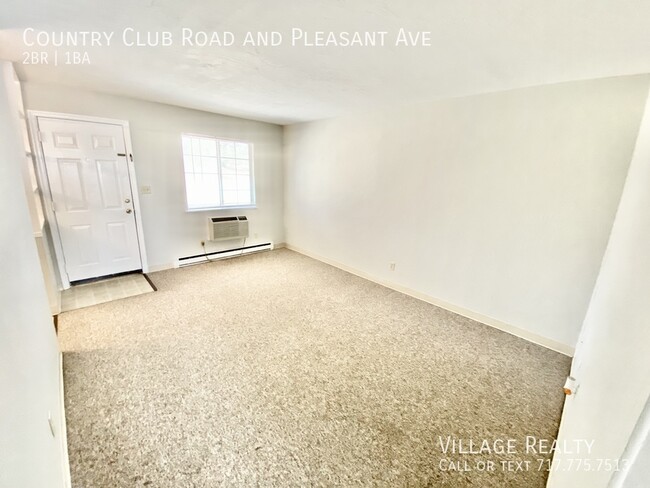 Building Photo - Roomy 2-bed end-unit w/ on-site laundry & ...