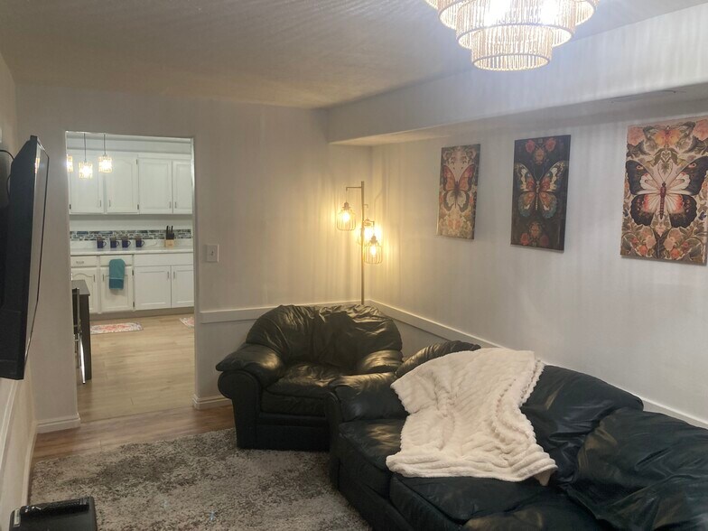 Living room. Leather couches. - 975 E 320 N