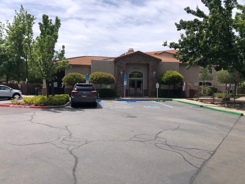 Property Club House at entrance. - 10001 Woodcreek Oaks Blvd