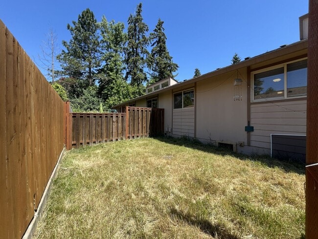 Building Photo - Bright and Airy Home with Stainless Steel Kitchen, Vaulted Ceilings & Washer + Dryer