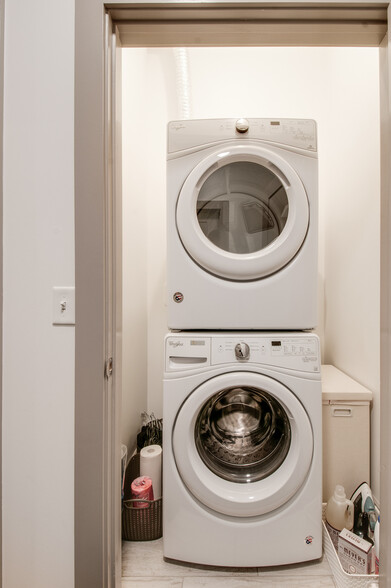 Washer/dryer included with additional laundry room storage. - 2407 8th Ave S