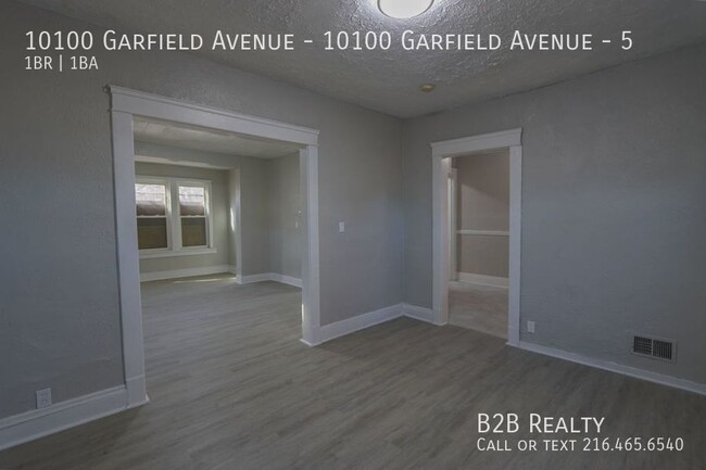 Building Photo - "Charming 1-Bedroom Oasis: Your Perfect Bl...