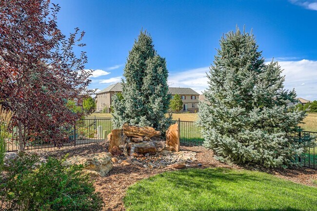 Building Photo - Beautifully maintained 5-bedroom home with a large finished basement, club access, and top-rated ...