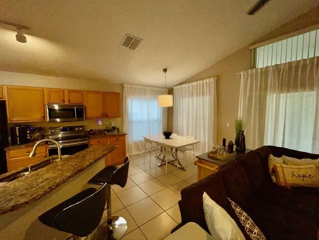 Building Photo - Modern 4-Bed, 2-Bath Solar-Powered Home Near UCF