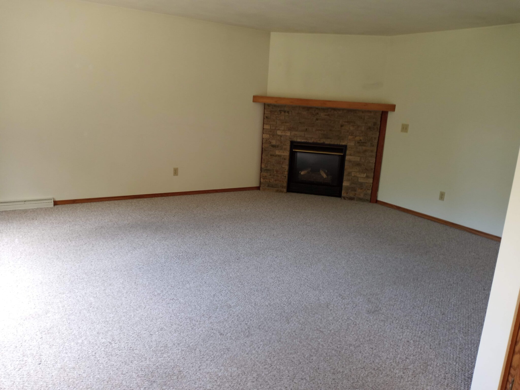 Living room new carpet thru out. New flooring thru out. - W3183 Westowne Ct