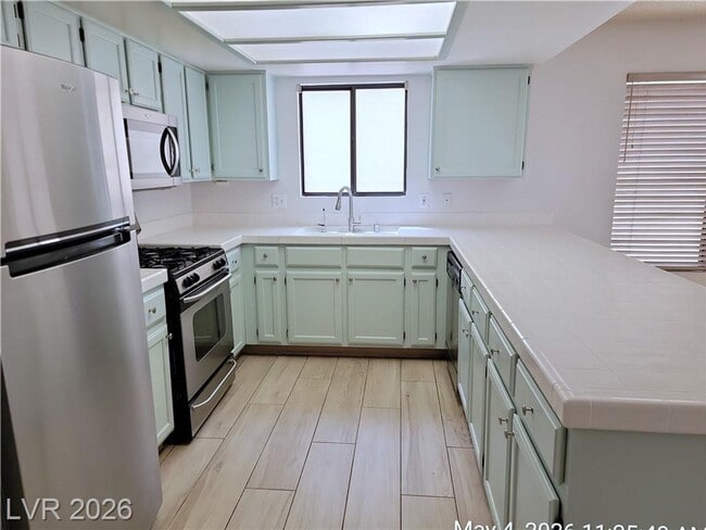 Building Photo - The Lakes Home with No Carpet, Fireplace & Covered Patio