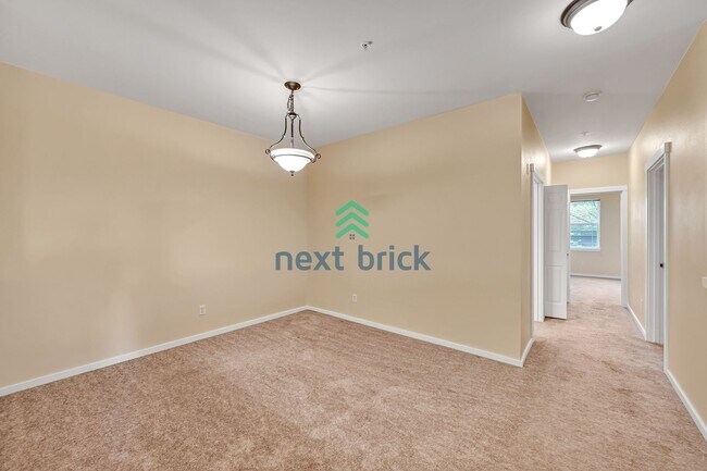 Building Photo - Rare Ground-Floor, End Unit with massive b...