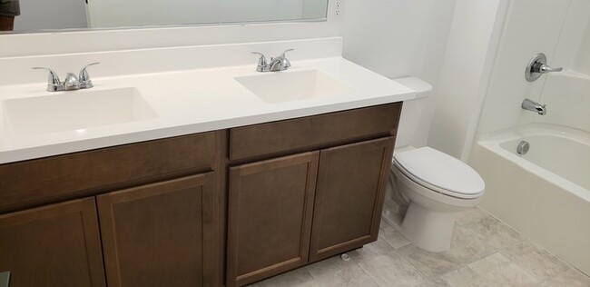 Building Photo - The 2 YEARS NEW 4 bedroom + 3 car garage r...