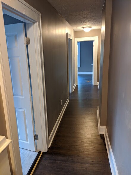 Upstairs hallway with 3 beds and 1 bath - 717 N Grant Ave