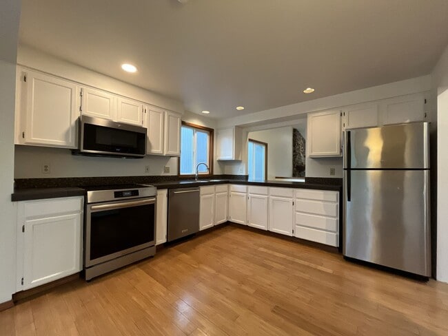 Building Photo - Spacious 3-Bedroom Home with Custom Stone Fireplace, Attached 2-Car Garage & Expansive Backyard i...