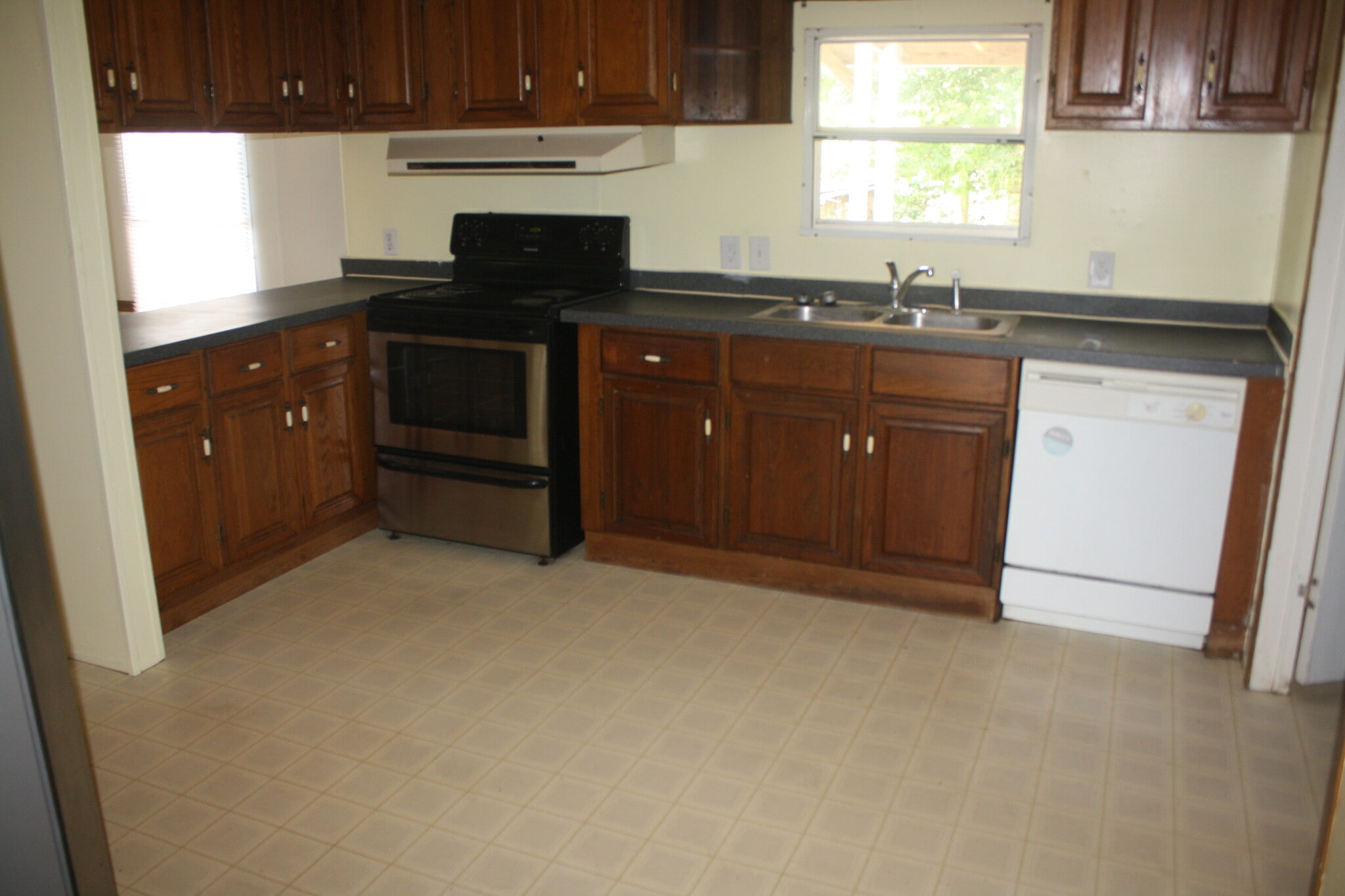 kitchen includes electric range and dishwasher - 3305 Peaceway Dr