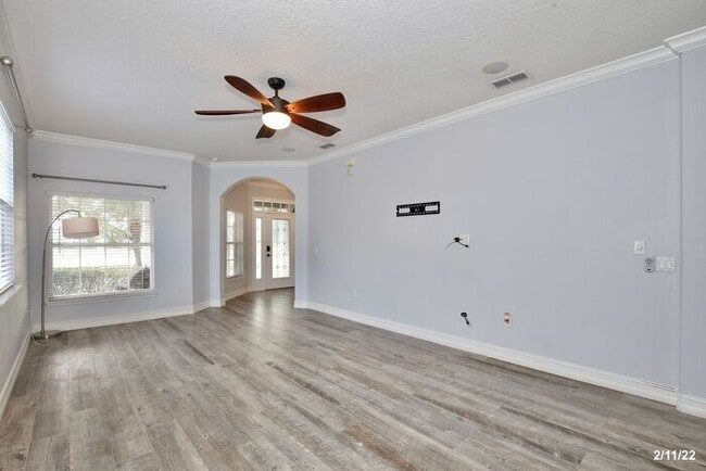 Building Photo - Luxurious 4/3 Waterfront Home with an In-ground Spa, an In-law Suite and a 2 Car Garage in the Hi...