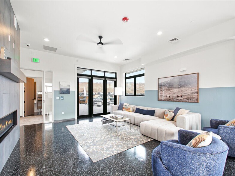 Common room with fireplace, TV, ping pong table, and more - 3850 E Haystack St
