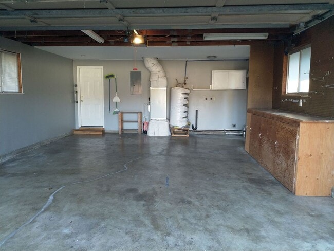 Building Photo - Charming updated 3 bed 1 bath ranch style home with double car garage and large fenced back yard.