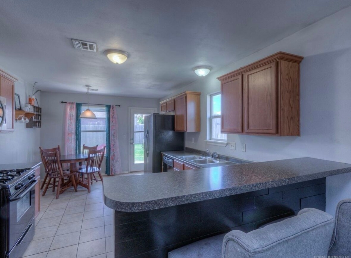 Stone has been added where the black painted wood is. - 120 Newman Cir