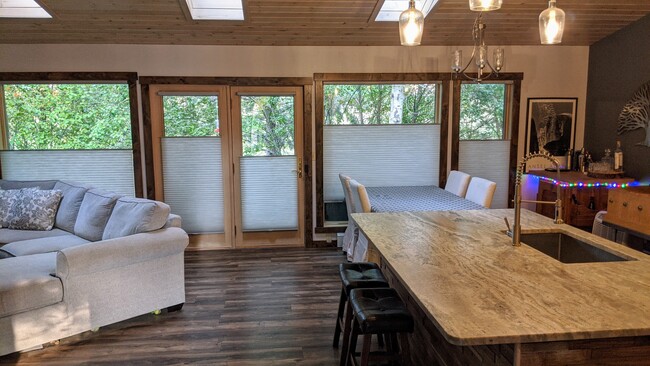 Wall of windows in kitchen/living room with brand new blinds. Top down bottom up. - 7 Willowbrook Close