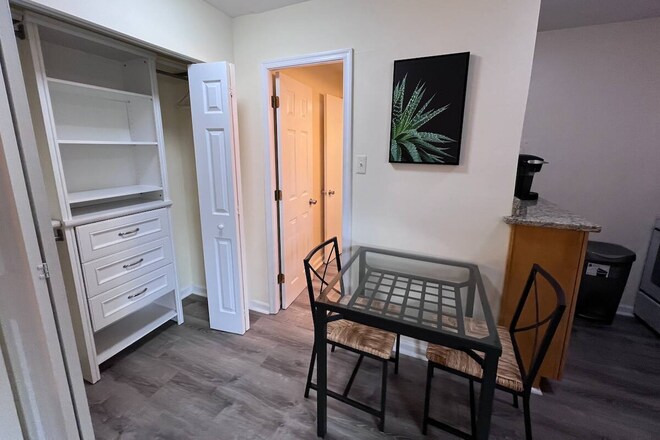closet with drawers, small dining table - 1420 N St NW