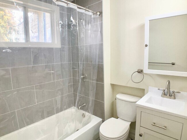 Building Photo - LOWERED PRICE! FULL FLOOR FLAT! Bay Window...