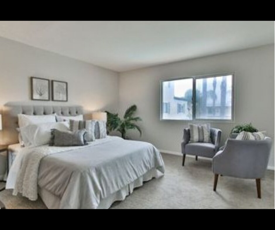 Furnished primary bedroom with closet space and natural light. - 940 Calla Ave
